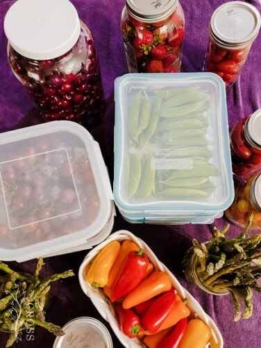 Fresh produce in Pyrex Snapware, Mason jars, and other pretty storage containers.