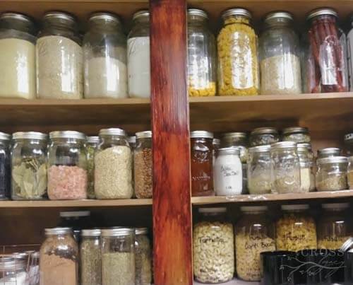Close up of Amy's pantry showing all of her dry goods in various size mason jars.
