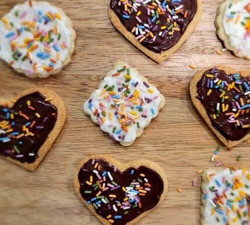 allergy-friendly sugar cookies with allergy-friendly frosting and sprinkles, all organic and ready to enjoy!