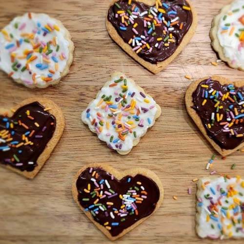 allergy-friendly sugar cookies with allergy-friendly frosting and sprinkles, all organic and ready to enjoy!