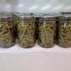 canned-green-beans-in-mason-jars-cooling-on-a-counter