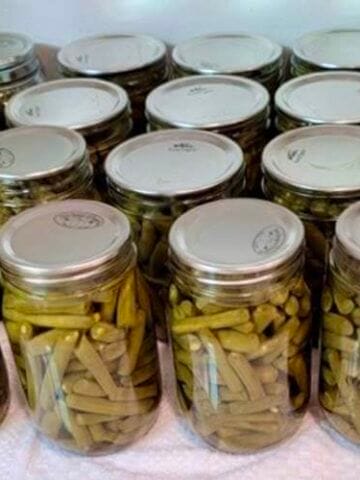jars-of-green-beans-cooling-on-the-counter-teaching-you-how-to-can-green-beans