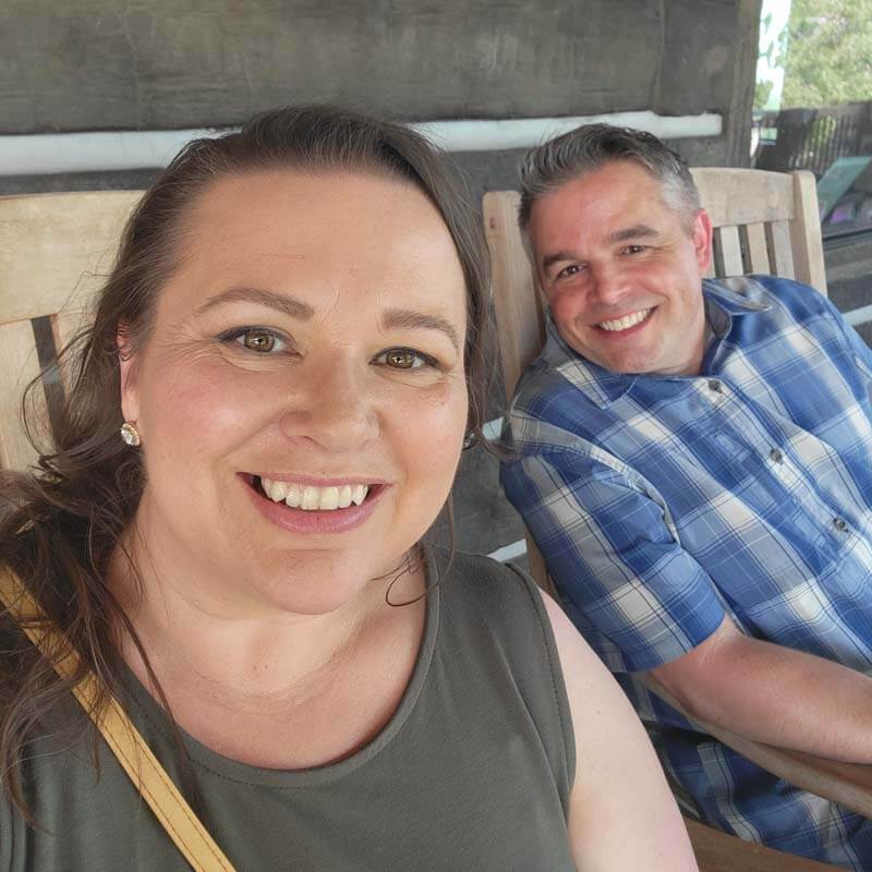 amy-and-mike-cross-relaxing-in-rocking-chairs-on-a-porch