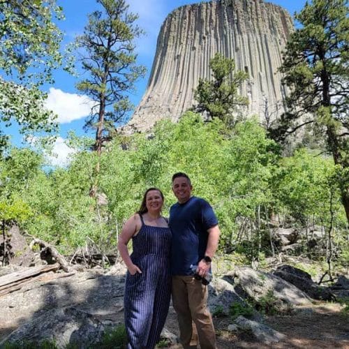 amy-and-mike-cross-standing-in-front-of-Devils-Tower