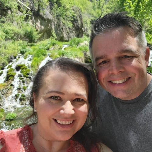 amy-and-mike-cross-taking-a-selfie-in-front-of-a-waterfall-at-Spearfish-Canyon