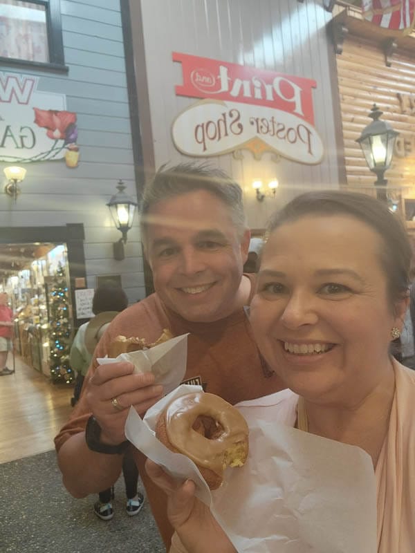 amy-and-mike-cross-enjoying-a-famous-Wall-Drug-in-South-Dakota-donut