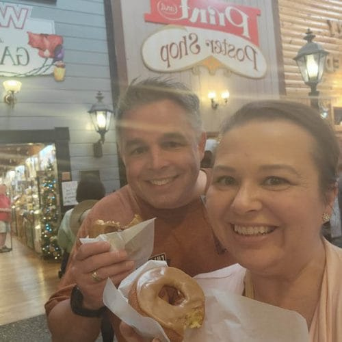 amy-and-mike-cross-enjoying-a-famous-Wall-Drug-in-South-Dakota-donut