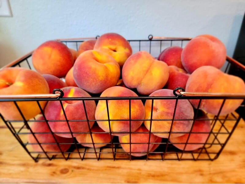 basket full of fresh peaches
