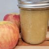 Easy Applesauce Recipe - Finished applesauce in jar with fresh apples