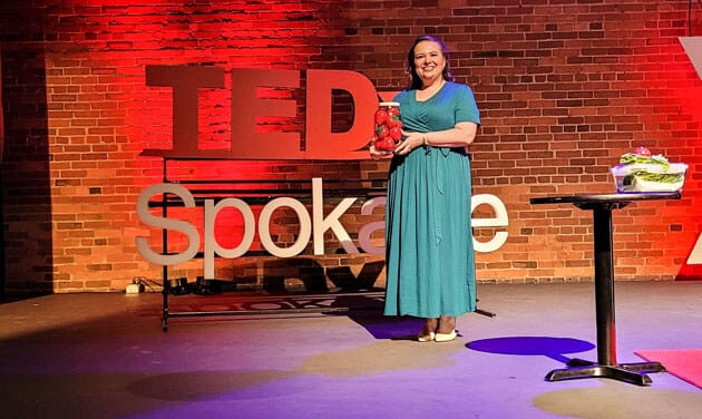 Amy Cross on the TEDx Spokane stage on October 8, 2022.