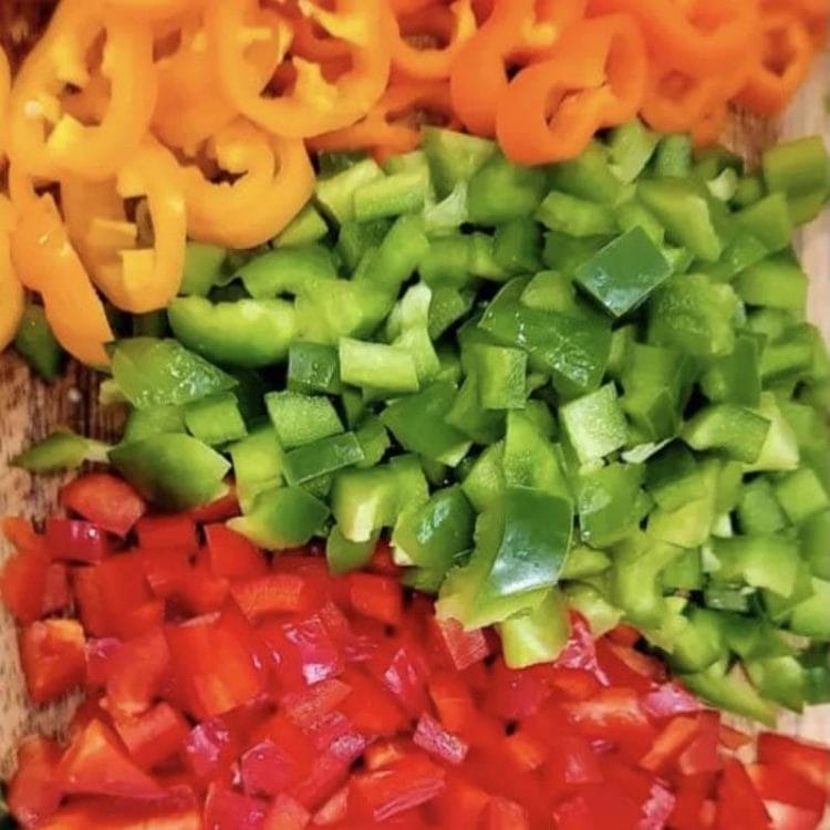 Chopped red, green, and yellow bell peppers.