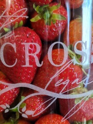 Strawberries in a Jar in a glass mason jar etched with The Cross Legacy logo.