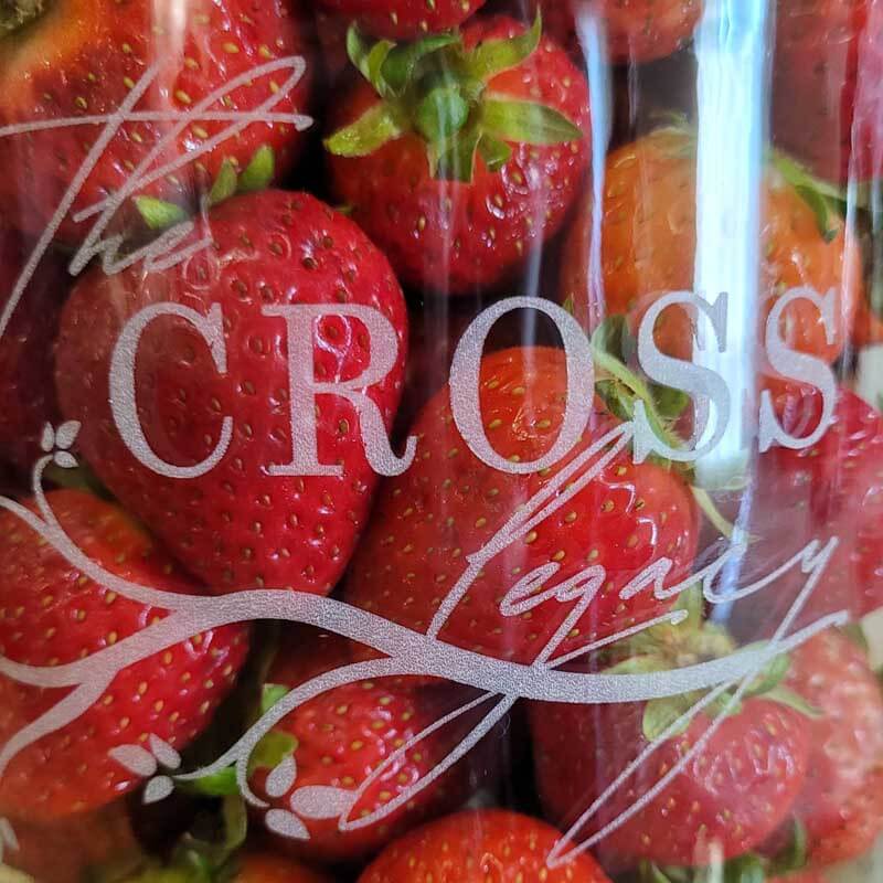 Strawberries in a Jar in a glass mason jar etched with The Cross Legacy logo.