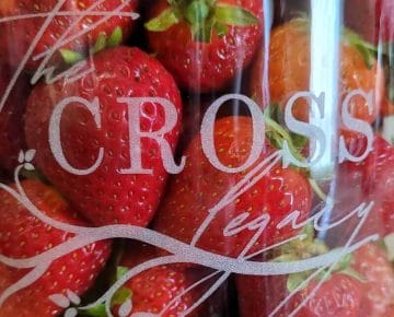 Strawberries in a Jar in a glass mason jar etched with The Cross Legacy logo.