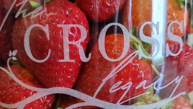 Strawberries in a Jar in a glass mason jar etched with The Cross Legacy logo.