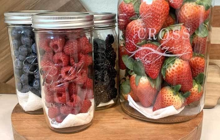 Fresh berries - Strawberries, Raspberries, Blackberries, and Blueberries in glass jars on the counter.