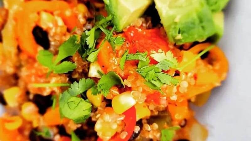 Mexican Quinoa Salad with Avocados on a white plate.