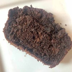 Slice of Chocolate Chip Zucchini Bread on a White Plate