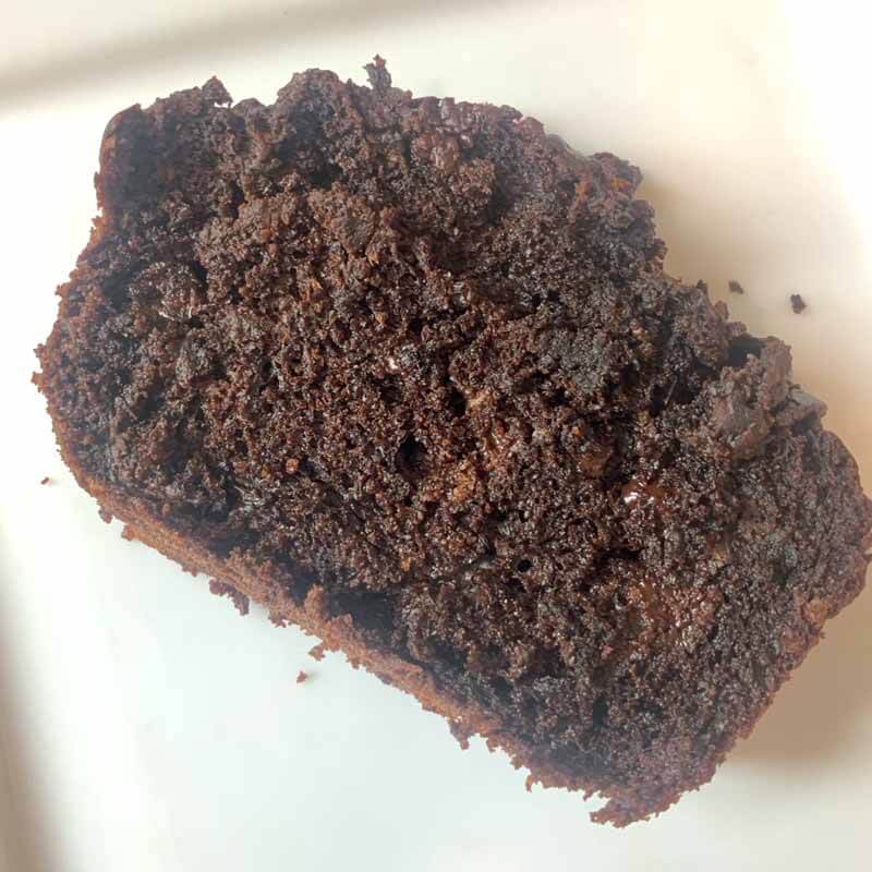 Slice of Chocolate Chip Zucchini Bread on a White Plate