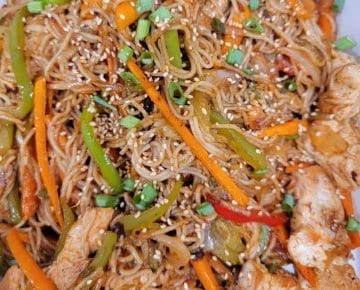 Finished Yakisoba Recipe using gluten free noodles, chicken, peppers, carrots, and onions.