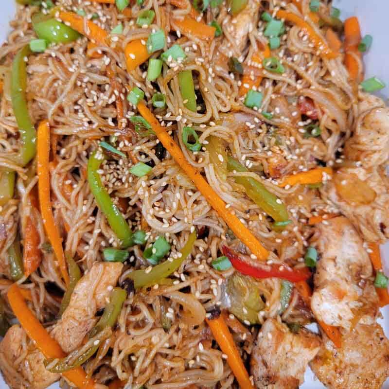 Finished Yakisoba Recipe using gluten free noodles, chicken, peppers, carrots, and onions.