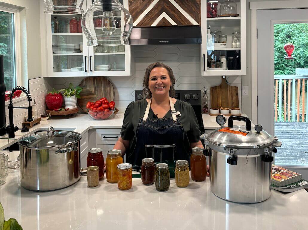 Amy Cross with two types of canners and canned products